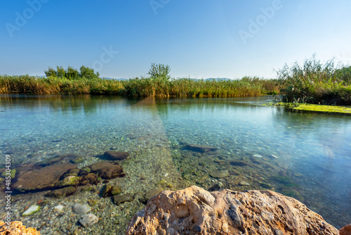 Crystal clear view of Azmak river in Akyaka. Akyaka (Gokova) is a coastal township district of Mugla Province in southwestern Turkey.