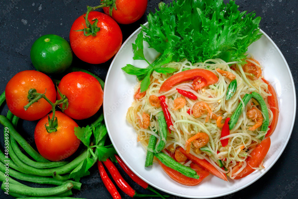 Thai papaya salad, Thai traditional Thai papaya salad Cooked with papaya, tomatoes, green beans and peanuts. Spicy Thai food concept. Thai papaya salad, Thai traditional Thai papaya salad Cooked with papaya, tomatoes, green beans and peanuts. Spicy Thai food concept.