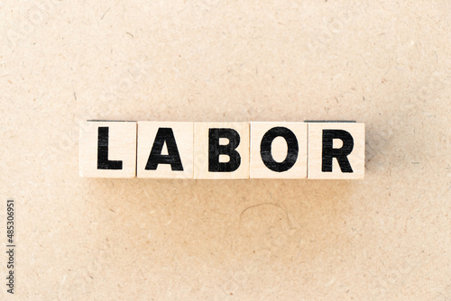 Alphabet letter block in word labor on wood background © bankrx