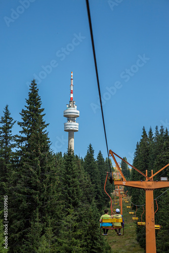 Empty chair lift ascending in Pamporovo winter mountain ski resort in Bulgaria during summer. photo