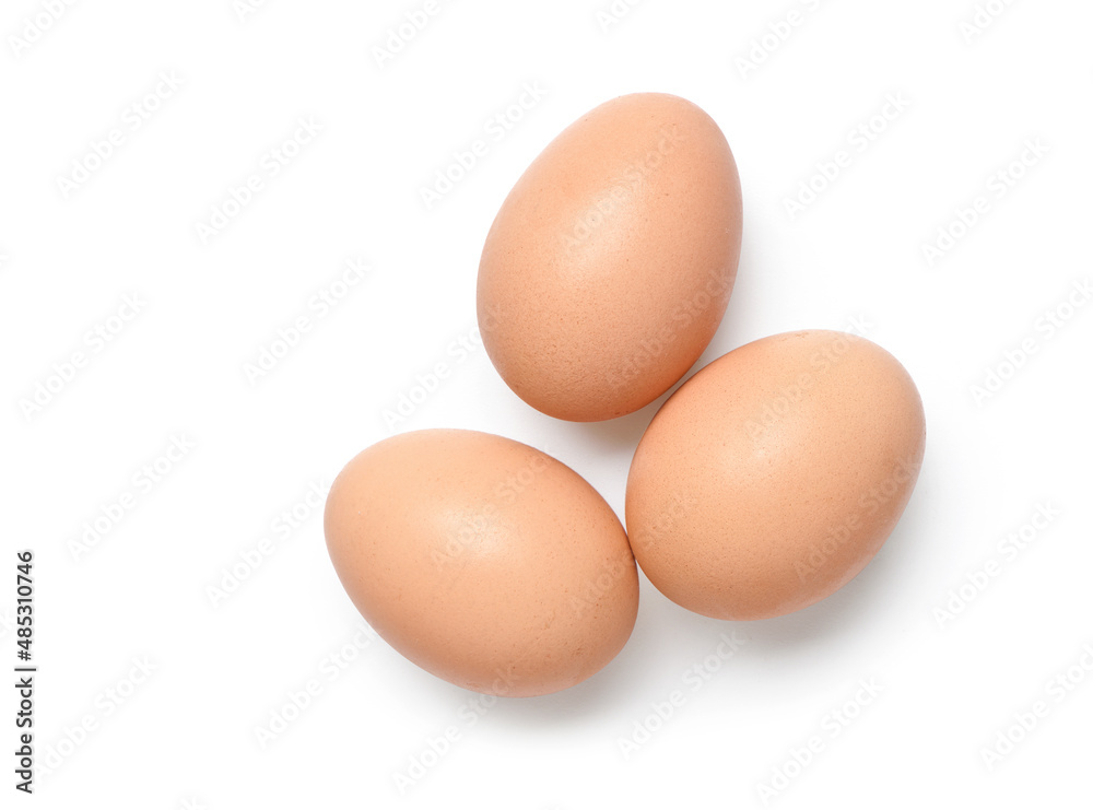Flat lay of three chicken eggs isolated on white background. Clipping path. Flat lay of three chicken eggs isolated on white background. Clipping path.