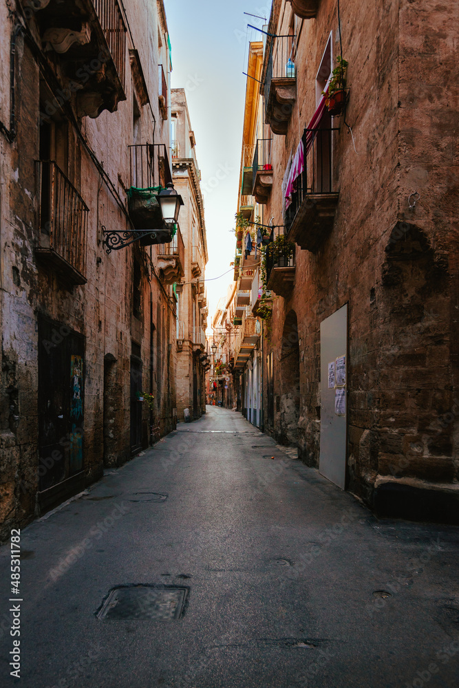 Sunlit alleyway in the old town of Taranto