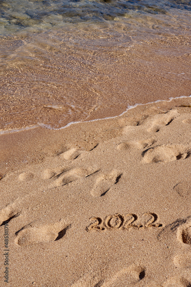 Inscription 2022 on the sand on the shores of the Red Sea. Inscription 2022 on the sand on the shores of the Red Sea.