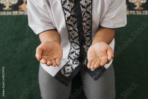 Top view a Muslim man's hand praying to Allah in the mosque © Gatot