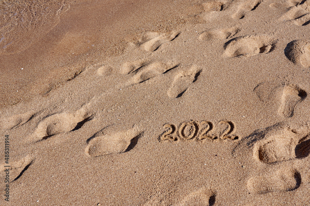Inscription 2022 on the sand on the shores of the Red Sea. Inscription 2022 on the sand on the shores of the Red Sea.