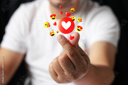 Man making heart with fingers, Speading love and happiness concept, Hand holding heart symbol Meaning of showing love, Mini heart. photo