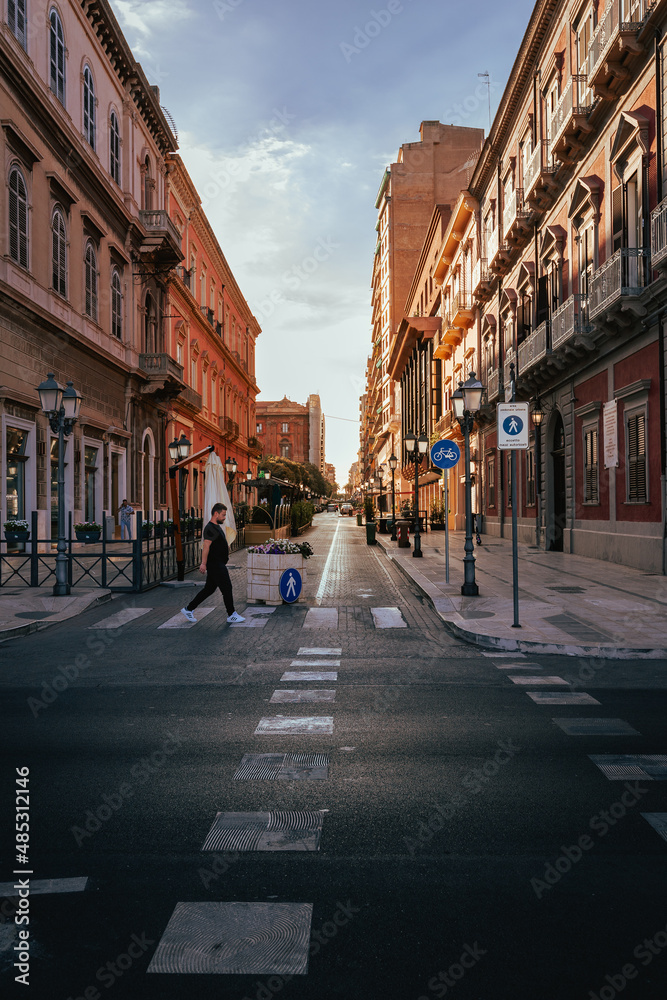 Man crossing the road in the centre of Taranto