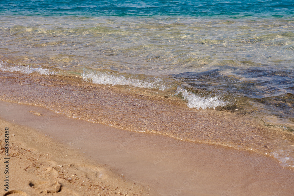 Waves on the tropical sandy beach of the red sea.