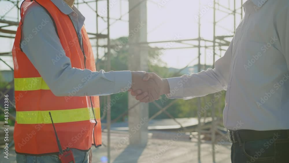 Shake hands Slow Motion video. Engineers and architects in safety uniforms holding hands in the building, Successful construction project, teamwork meeting. Shake hands Slow Motion video. Engineers and architects in safety uniforms holding hands in the building, Successful construction project, teamwork meeting.