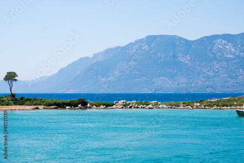 View of Sedir Island from a distance. Sedir Island (Turkish: Sedir Adasi), also known as Cleopatra Island, is a small island in the Gulf of Gokova of southeastern Aegean Sea in Turkey. photo