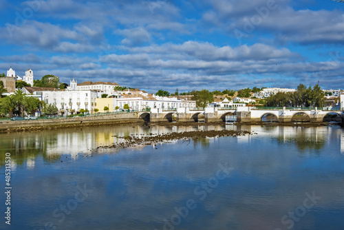 seven-arched Roman Bridge over the Gilão River in Tavira, Algarve / Portugal