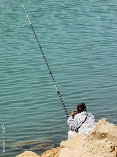 Fisherman fishing on a Moroccan beach