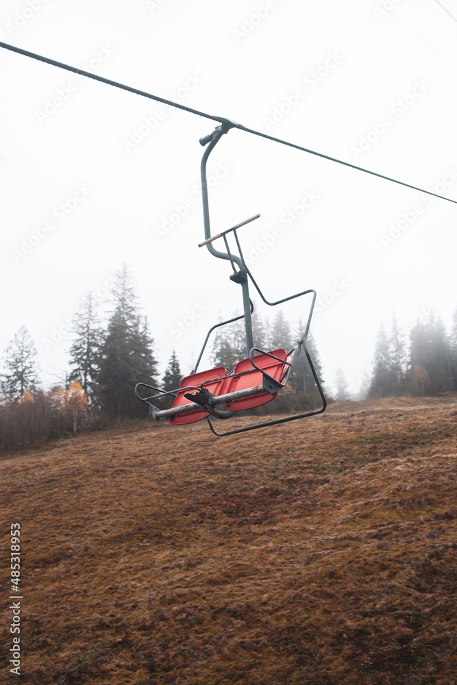 A ski lift is a mechanism for transporting skiers up a hill. Ski lifts are typically a paid service at ski resorts. A ski lift is a mechanism for transporting skiers up a hill. Ski lifts are typically a paid service at ski resorts.