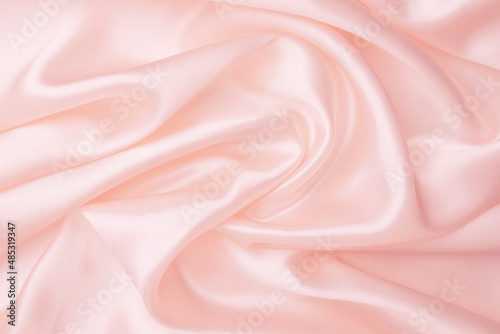 Elegance pink satin silk with waves, abstract background luxury cloth, elegant design. Abstract background luxury cloth or liquid wave