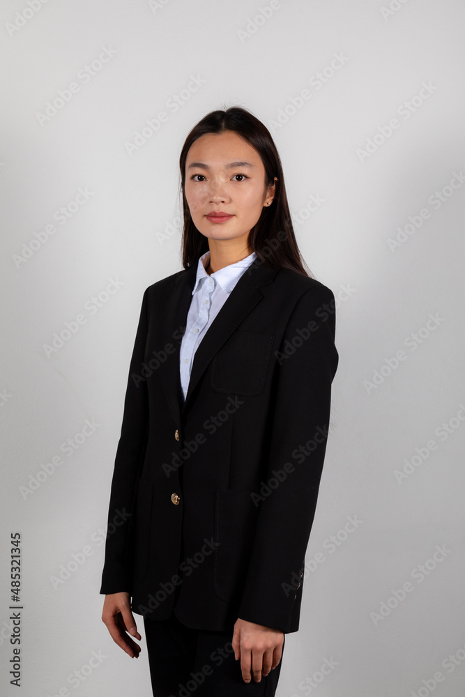 Portrait of a serious young asian business woman wearing a suite costume Portrait of a serious young asian business woman wearing a suite costume