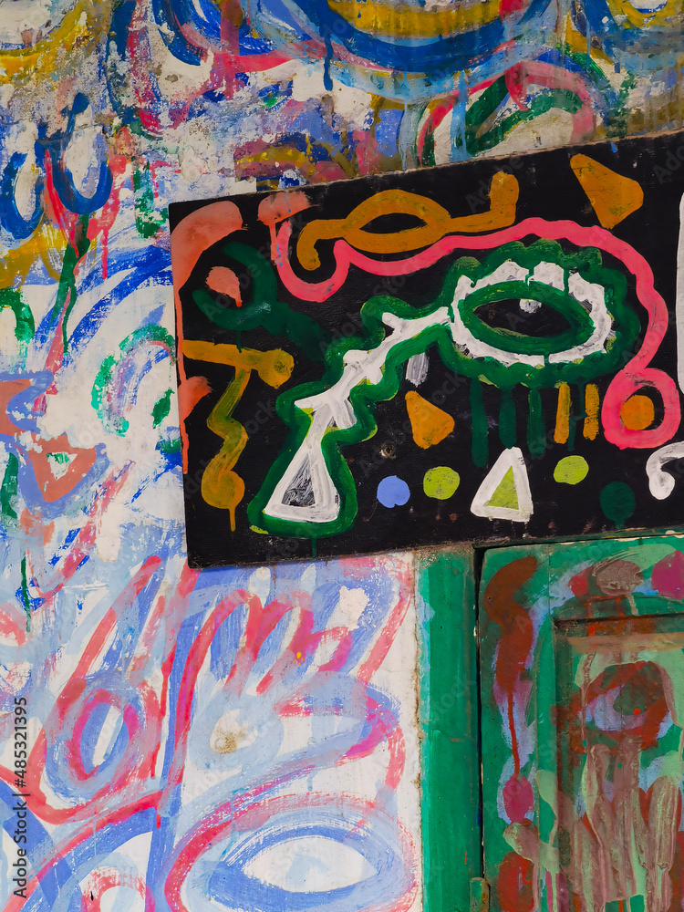 Multiple colour splashes on a wall in the medina of Asilah Multiple colour splashes on a wall in the medina of Asilah