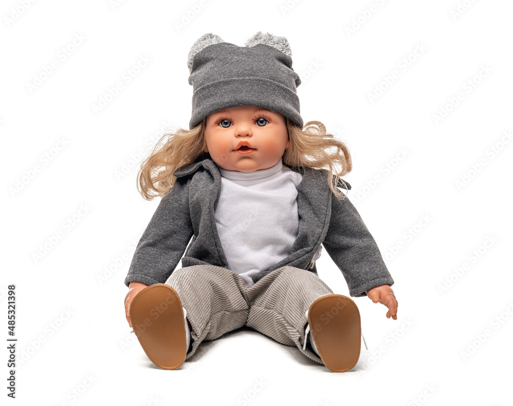 Little plastic doll baby girl isolated on white background. Little plastic doll baby girl isolated on white background.