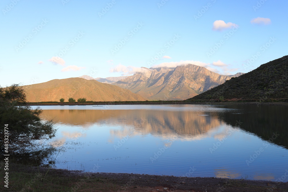 Mountains reflected in a farm dam near Worcester, South Africa.