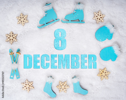 December 8th. Sports set with blue wooden skates, skis, sledges and snowflakes and a calendar date. Day 8 of month.