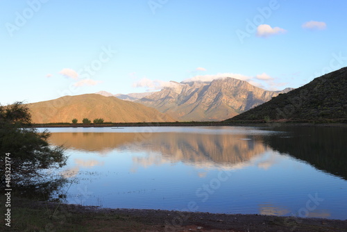 Mountains reflected in a farm dam near Worcester, South Africa.