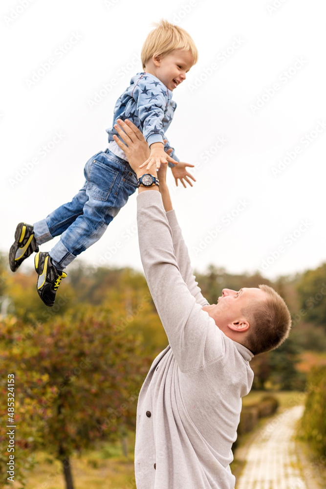 Happy joyful father having fun throws up in the air child. Family, travel, vacation, father's day concept. Happy joyful father having fun throws up in the air child. Family, travel, vacation, father's day concept.