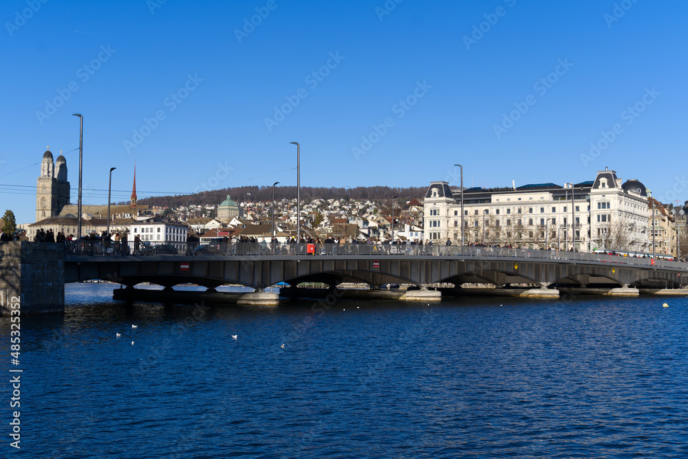 Cityscape of the old town of Zürich with lake Zürich in the foreground on a sunny winter day. Photo taken February 5th, 2022, Zurich, Switzerland.