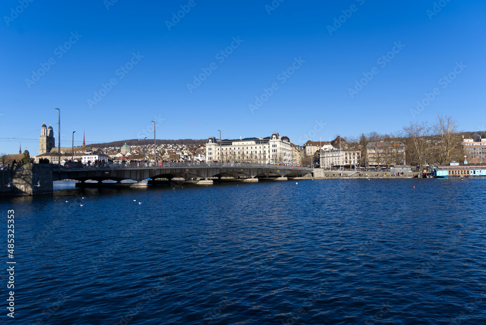 Cityscape of the old town of Zürich with lake Zürich in the foreground on a sunny winter day. Photo taken February 5th, 2022, Zurich, Switzerland.