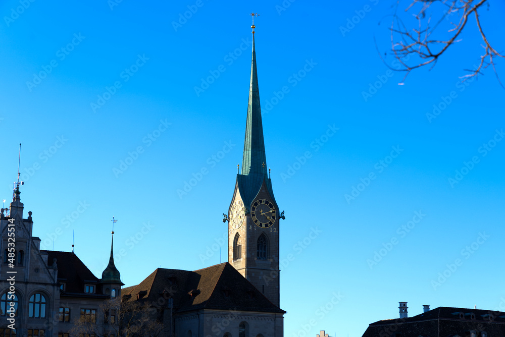 Church tower of medieval protestant church Women's Minster at the old town of Zürich on a sunny winter day. Photo taken February 5th, 2022, Zurich, Switzerland.