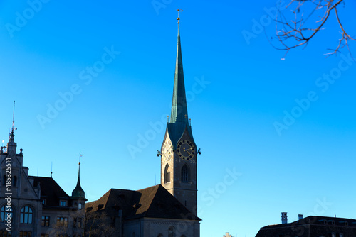 Church tower of medieval protestant church Women's Minster at the old town of Zürich on a sunny winter day. Photo taken February 5th, 2022, Zurich, Switzerland.