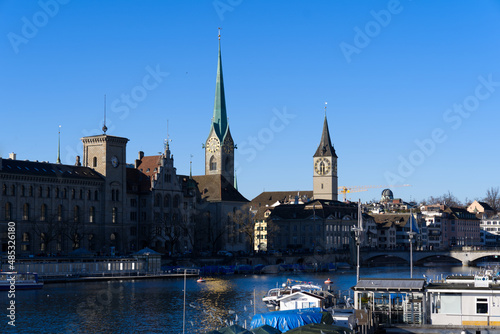 Church tower of medieval protestant churches Women s minster and St. Peter at the old town of Z  rich on a sunny winter day. Photo taken February 5th  2022  Zurich  Switzerland.