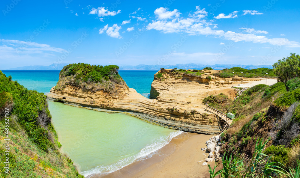 Obraz premium Canal D'Amour or Channel of Love in Sidari, Corfu island in Greece. Famous romantic beach with clay rocky cliffs and rugged coast. Popular destination for summer vacation