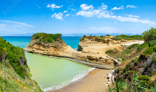 Canal D'Amour or Channel of Love in Sidari, Corfu island in Greece. Famous romantic beach with clay rocky cliffs and rugged coast. Popular destination for summer vacation photo