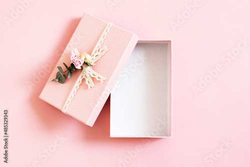 Beautiful empty open pink gift box isolated on pastel background. Gift for holiday, birthday, Wedding, Mother's Day, Valentine's day, Women's Day. Copy space. Top view, flat lay. © Lyubov
