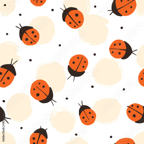Seamless pattern with cute ladybugs. Perfect for baby clothes, textiles, wallpaper, prints, paper and other surfaces.