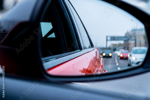 View of the road in the car mirror