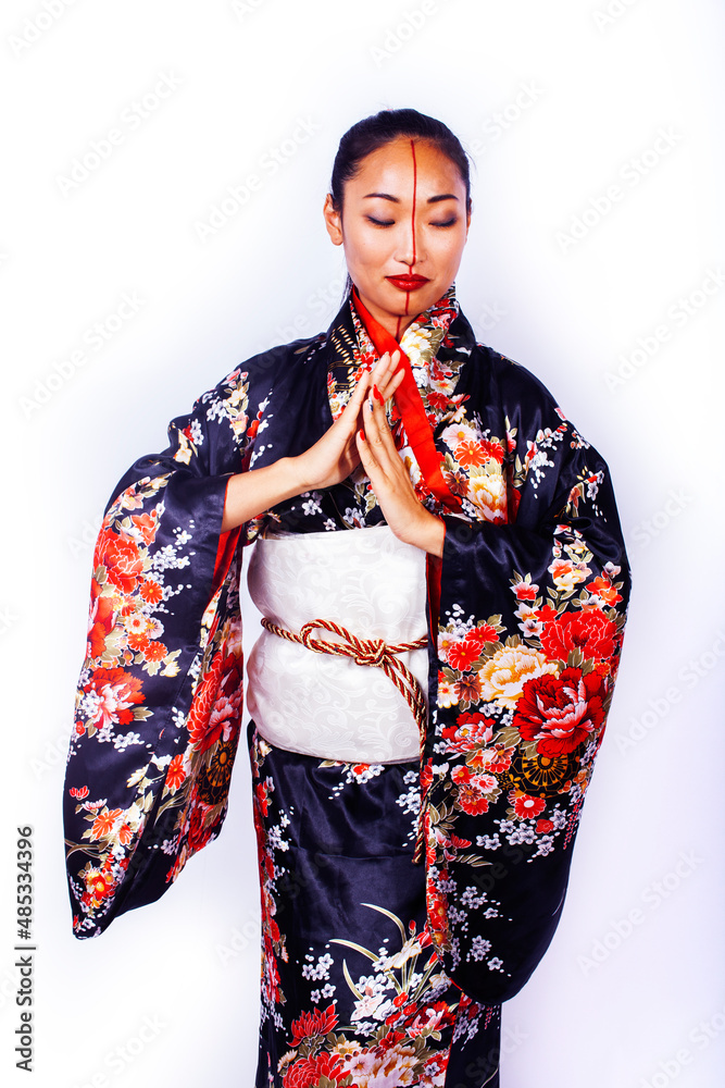 young pretty geisha in black kimono posing isolated on white background, asian ethno young pretty geisha in black kimono posing isolated on white background, asian ethno