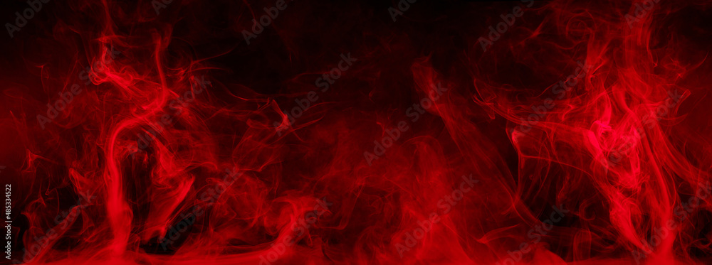 Abstract colored smoke moves on black background. Mystical swirling smoke rolling low across the ground. Abstract colored smoke moves on black background. Mystical swirling smoke rolling low across the ground.