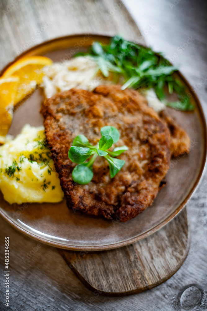 Pork breaded cutlet coated with breadcrumbs with mashed potatoes Pork breaded cutlet coated with breadcrumbs with mashed potatoes
