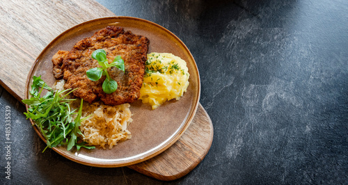 Bild auf Leinwand Pork breaded cutlet coated with breadcrumbs with mashed potatoes