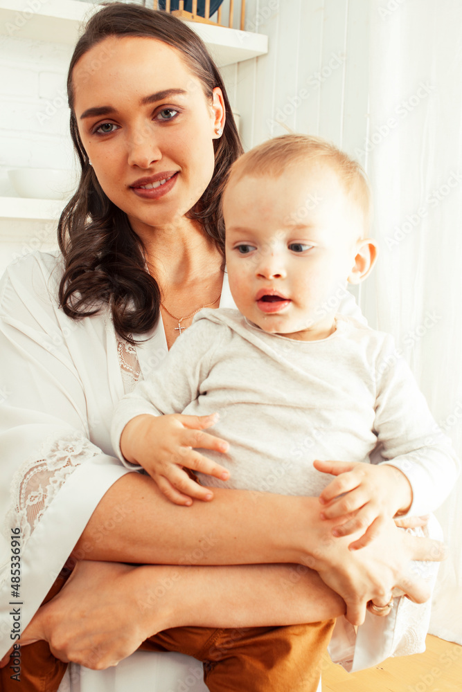 young happy brunette mother with little cute son at home having fun happy smiling, lifestyle people concept young happy brunette mother with little cute son at home having fun happy smiling, lifestyle people concept