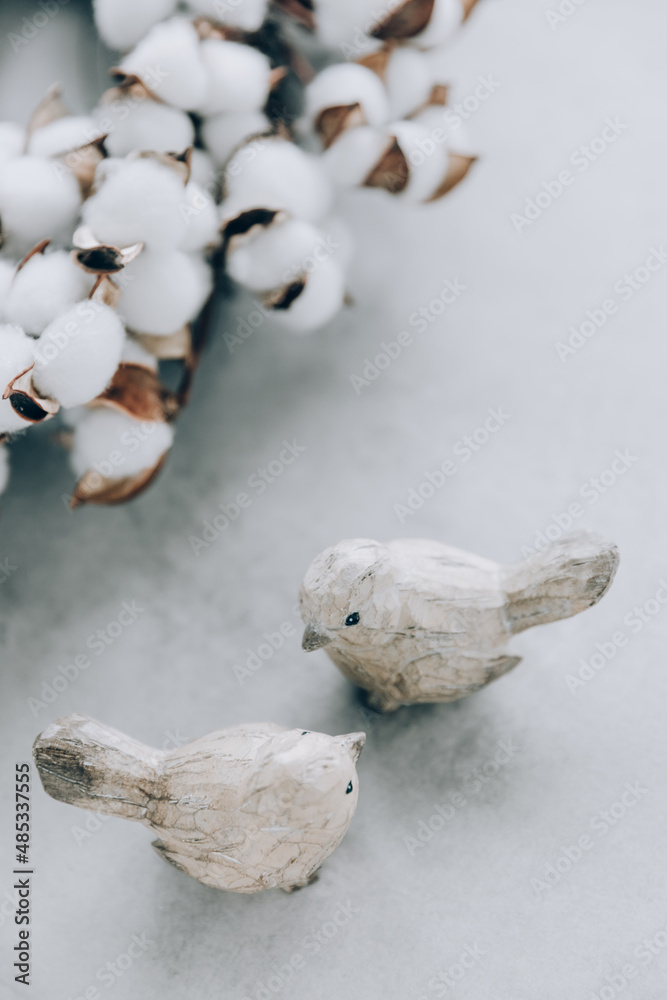 Two wooden birds on gray background. Spring decoration, easter elements. Two wooden birds on gray background. Spring decoration, easter elements.