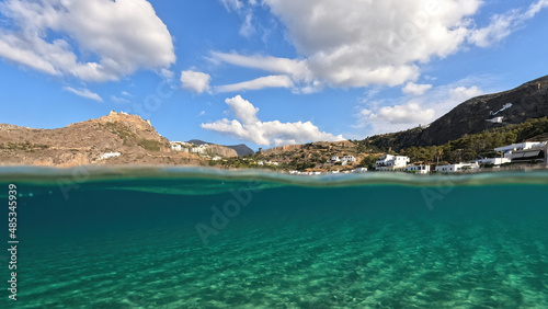 Fototapeta Naklejka Na Ścianę i Meble -  Underwater split photo taken from beautiful emerald bay and beach of Kapsali overlooking famous castle of Kythira island, Ionian, Greece