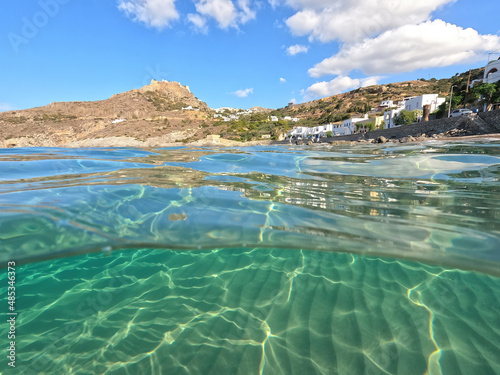 Underwater split photo taken from beautiful emerald bay and beach of Kapsali overlooking famous castle of Kythira island  Ionian  Greece