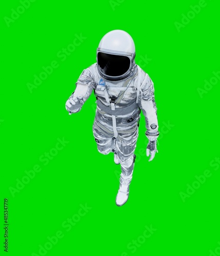 Astronaut isolated on green background.