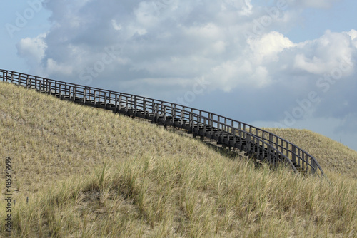 A wooden stairway in the dunes of Petten, the Netherlands, leading to a viewing point 