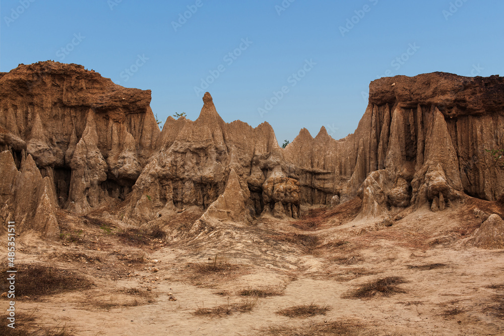 Ancient rock formations in peculiar shapes, in an area known for its excavated Paleolithic relics (Sao Din Na Noi) in Nan Province, Thailand Ancient rock formations in peculiar shapes, in an area known for its excavated Paleolithic relics (Sao Din Na Noi) in Nan Province, Thailand