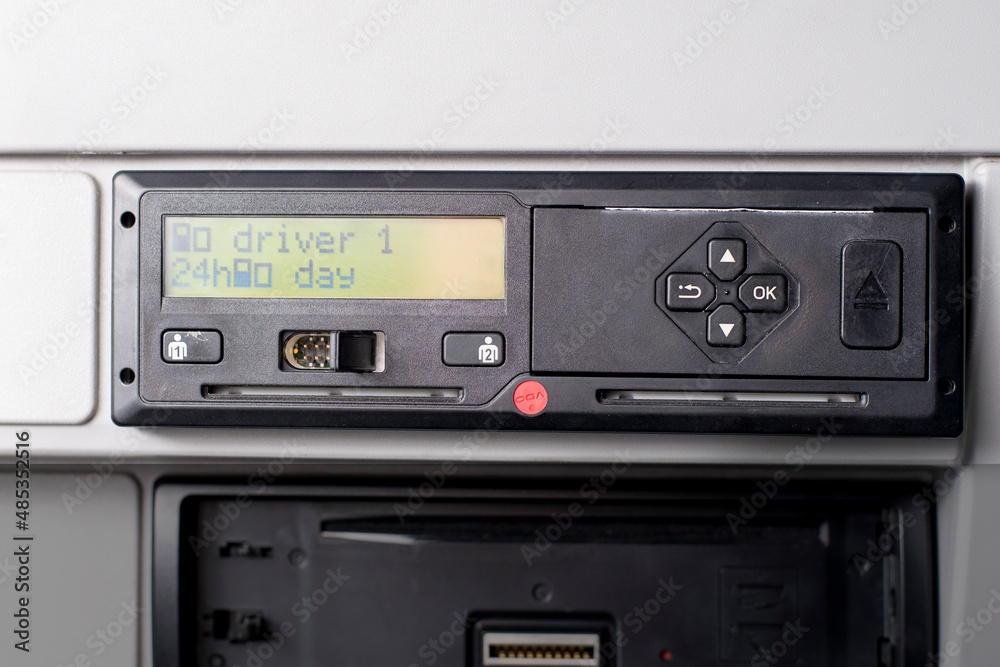 Obraz premium Close up of tachograph with 15 minutes of driving left warning on display. Driver is due to take 45 minutes break.