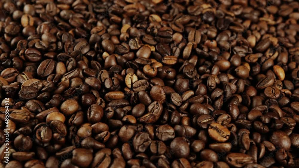 Texture of freshly coffee beans. Lots of roasted beans for preparation of fragrant drink. Close up. Texture of freshly coffee beans. Lots of roasted beans for preparation of fragrant drink. Close up.
