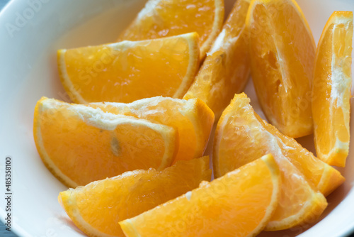 Sliced orange on white plate