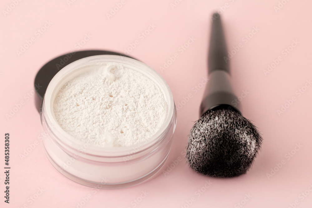 A jar of white face powder on a gentle
